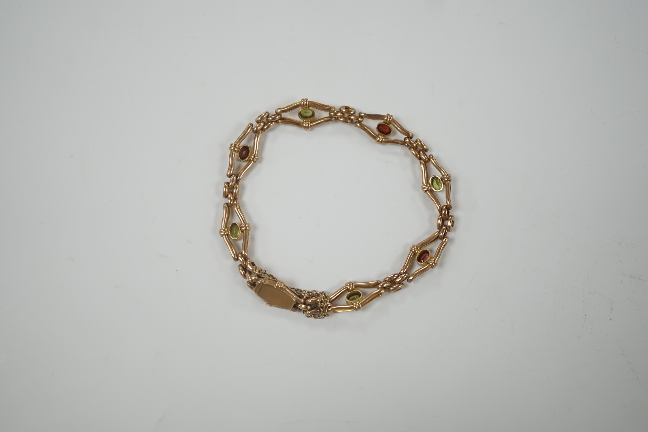 An Edwardian 9ct and gem set open link bracelet, 18cm, gross weight 9.3 grams.